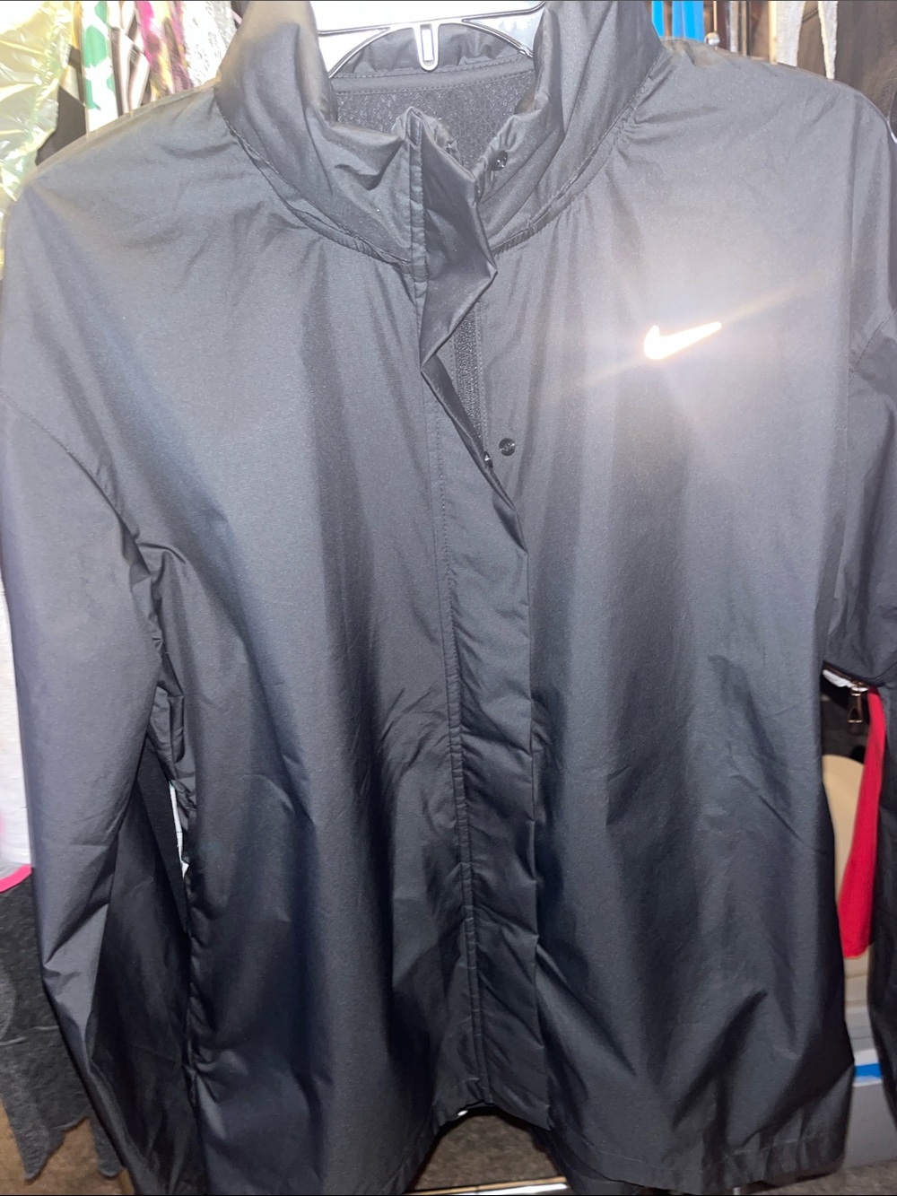 Nike Black Women's Lightweight Utility Jacket with Reflective Swoosh and hood.